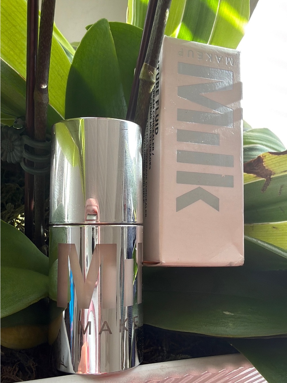 Milk Makeup Primer Stick in Shiny Silver Case with Soft Pink Box